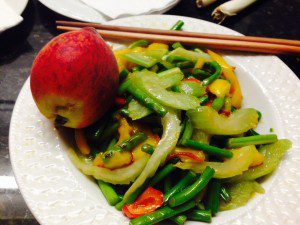 GARLIC STEMS, RED PEPPER, FENNEL, AND PEACH TOSS